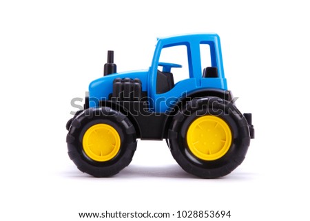 Tractor. Toy for children. Toy tractor on white background.
