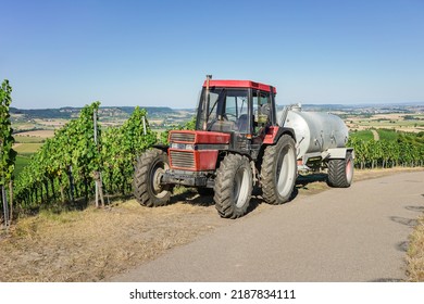 Tractor And Water Tank For Watering The Vines In Agriculture