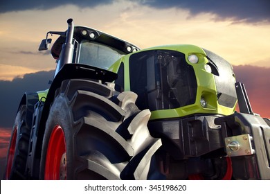 Tractor working on the farm, a modern agricultural transport, a farmer working in the field, tractor at sunset, modern tractor closeup - Shutterstock ID 345198620