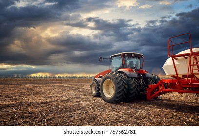 Tractor working on the farm, a modern agricultural transport, a farmer working in the field, fertile land, tractor on a sunset background, cultivation of land, agricultural machine - Shutterstock ID 767562781
