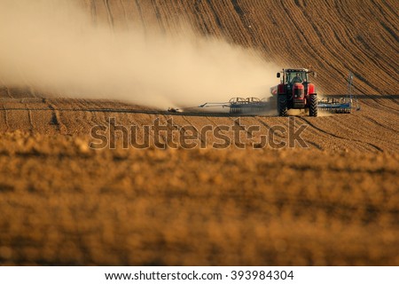 Tractor works in field