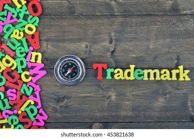 Trademark Word On Wooden Table