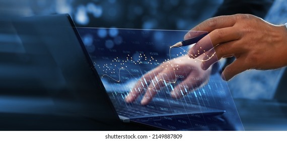 Trader analyzing data on virtual screen. Stock market and business investment. Price graph and indicator.
Stock market invest and crypto currency.  - Shutterstock ID 2149887809