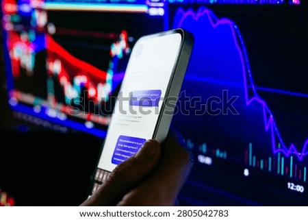 A trader or a financial analyst checking the recent stock exchange trends sending messages on the smartphone.