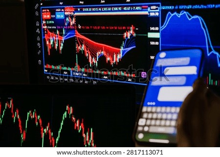 A trader or a financial analyst checking the recent stock exchange trends sending messages on the smartphone.