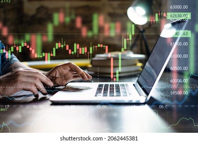 Trader at home, working on laptop with graphs and diagrams. Business man analyzing indexes, financial chart, trading online, investment data on cryptocurrency stock market. Remote work