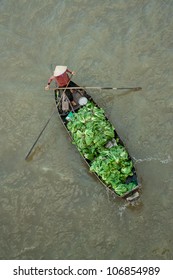 Trader on floating asia market