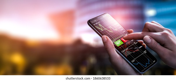 Trader Trades In Financial Instruments. Making Trading Online On The Smart Phone On City Background.