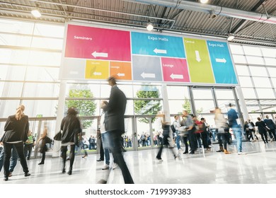 Tradeshow Visitors Rushing In A Modern Hall