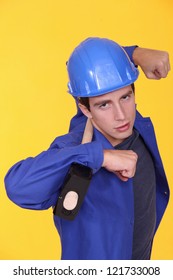 Tradesman Holding A Mallet On His Shoulders