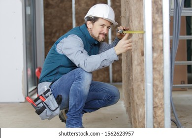 Tradesman Measuring Insulated Partition Wall