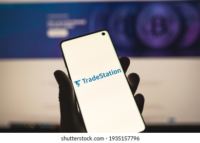 TradeStation App Logo On A Smartphone With Blurred Website As Background. Online Brokerage, Trading Service. SWANSEA, UK - MARCH 12, 2021