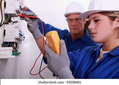 Tradeswoman Using A Multimeter