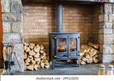 Tradional Wood Burning Stove in a Brick Fireplace