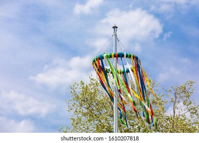 tradiotional maypole with blue sky in may