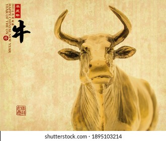 Tradition Chinese golden statue ox,2021 is year of the ox,Chinese characters translation: "ox".leftside chinese wording and seal mean:Chinese calendar for the year.