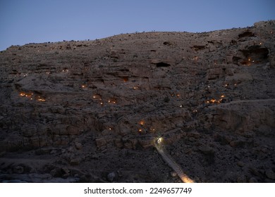The tradition of lighting candles in front of the Mer Saba Monastery in the Yehuda Desert - Shutterstock ID 2249657749