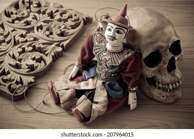 tradition Myanmar style string puppet for tourist souvenir with skull and wood carve in vintage color tone