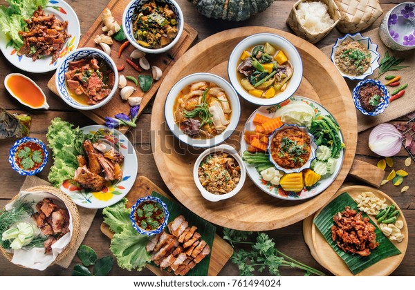 Tradition\
Northern Thai food. on a wooden table, top\
view