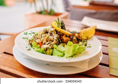 Traditional Adriatic Sea Food Salad With Fresh Mussels In White Plate. Traveling In Piran, Slovenia. Selective Focus.