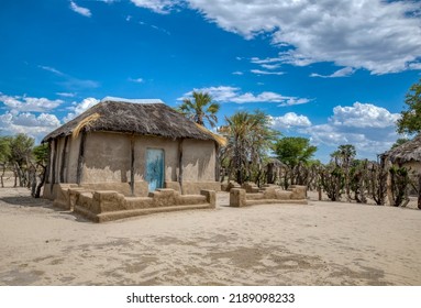 Traditional Africa Hut With A Thatched Roof In A Village In Botswana