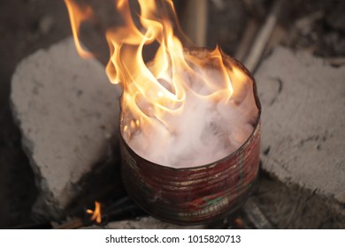 Traditional African Cashew Roasting - Old Can With Huge Flames