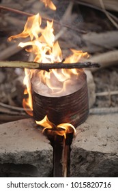 Traditional African Cashew Roasting - Old Can With Huge Flames