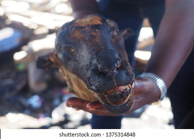 Traditional african sheep's head, cooked on flames, known as a "smiley".   