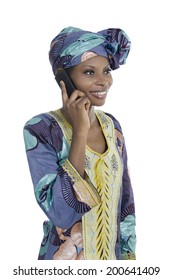 Traditional african woman talking with smart phone, Studio Shot