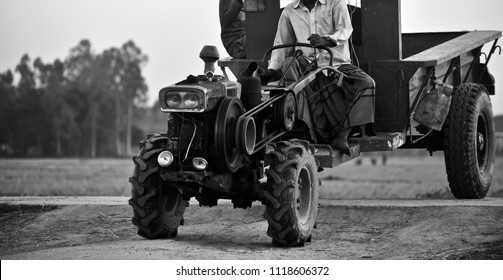 A Traditional Agricultural Tractor Four Wheeler Vehicles Isolated Unique Photograph