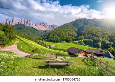 Traditional alpine St Johann church in Val di Funes valley, Santa Maddalena touristic village, Dolomites, Italy, Europe