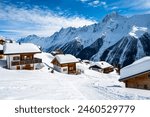 Traditional alpine wooden houses in winter mountain snow landscape, Loetschental valley, Switzerland