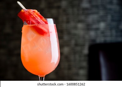 Traditional American Craft Cocktails Made By Artisanal Bartenders Or Mixologists In Speakeasy & Upscale Bars Or Dive Bar Taverns. Cocktails Served In Chilled Cocktail Glasses And Garnished With Fruit.