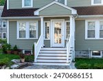 Traditional American residential style home with multi-pane glass door and gabled portico, Brighton, Massachusetts, USA