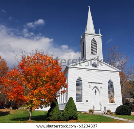 Traditional American white church in the fall