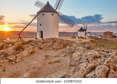 Traditional antique windmills at sunset in Spain. Consuegra, Toledo. Travel 