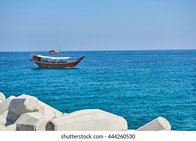 Traditional Arab Dhow Carrying Tourists Off The Omani Coast