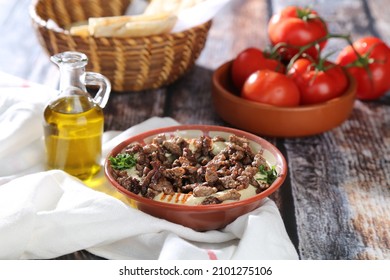 Traditional Arab and Lebanese Middle Eastern Hummus and Meat on top - Shutterstock ID 2101275106