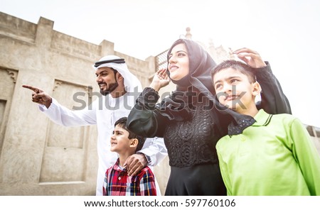 Traditional arabian family walking in the old town