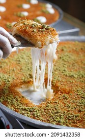 Traditional Arabian kunafa, konafa with Cream and Cheese with pistachio nuts on top
