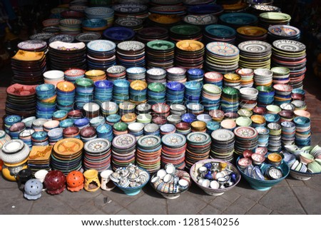 Similar – many part colorful tin buckets at the flea market