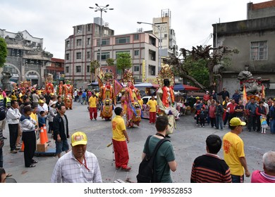 Traditional Asian Festival Parade With Colorful Costumes, Masquerade, Dance Performance In Religious Celebration Ceremony At Taiwanese Hotsu Longfong Temple, Miaoli City, Taiwan, Asia. April 15, 2018.