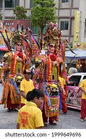 Traditional Asian Festival Parade With Colorful Costumes, Masquerade, Dance Performance In Religious Celebration Ceremony At Taiwanese Hotsu Longfong Temple, Miaoli City, Taiwan, Asia. April 15, 2018.