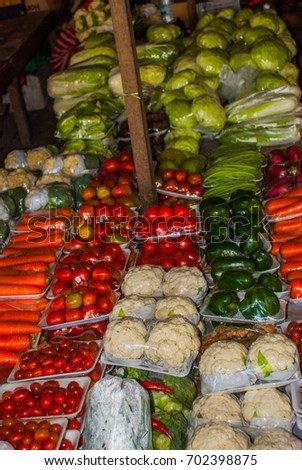 The traditional Asian market with food. Sale a variety of vegetables lying on the counter. Malaysia