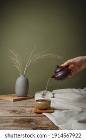 Traditional Asian Tea Ceremony  On A Wooden Table. Female Hand Pouring Tea From A Teapot. Vintage Style. With Space For Text. China, Tea, Tableware, Tradition, Health, Tea Ceremony, Asia.