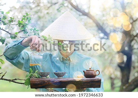traditional asian tea ceremony in spring blooming garden abstract china background