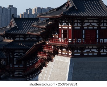 Traditional Asian-style temple with ornate roofs and red accents against urban skyline. - Powered by Shutterstock