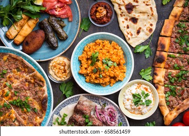 Traditional assorted turkish dishes. Turkish pizza, meat kebab, pita, bulgur, fried meatballs, hummus and turkish meze set. Middle eastern dinner. Food party. Turkish cuisine. Top view. Eastern food