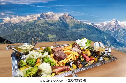 Traditional Austrian Food Experience Over Zell Am See Village With Kitzsteinhorn Peak ( Tauern Alps) In Austria 