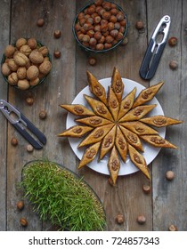 Traditional Azerbaijan Holiday Nowruz Cookies Baklava On White Plate On The Rustic Background With Nuts And Huzelnuts On Green Plate ,flat Lay